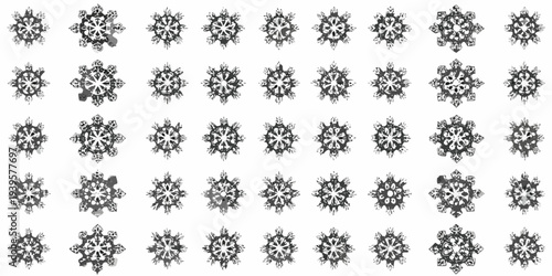 Intricate arrangement of diverse delicate snowflake patterns in monochrome