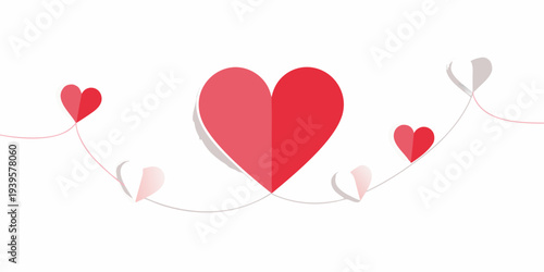 A string of red and pink paper hearts against a white background