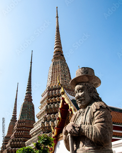A western style Farang Guard under a blue sky at Wat Pho, Bangkok