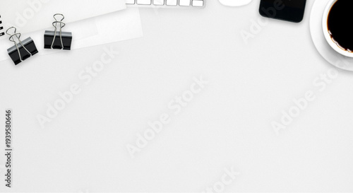 Modern workspace setup with office supplies and coffee