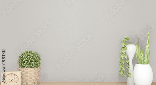 Modern indoor plants and clock on wooden desk against gray wall