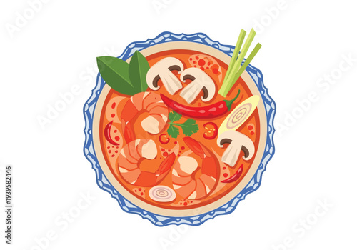 A visually appealing top-down view of spicy Tom Yum soup with shrimp and mushrooms, served in a decorative blue-rimmed bowl.