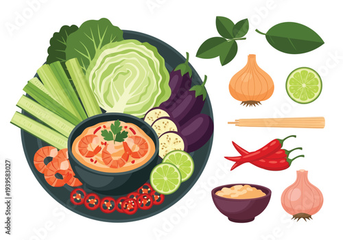 A large platter of fresh vegetables and chili paste dip with shrimp, surrounded by individual ingredients for preparation, is displayed.
