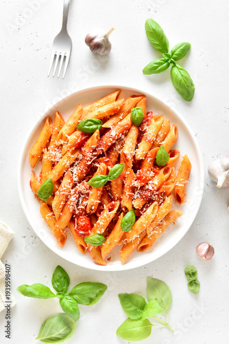 Italian penne pasta with tomato bolognese sauce on plate