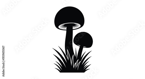 Solid black silhouette of two mushrooms of different sizes growing in a patch of tall grass, isolated on a white background.