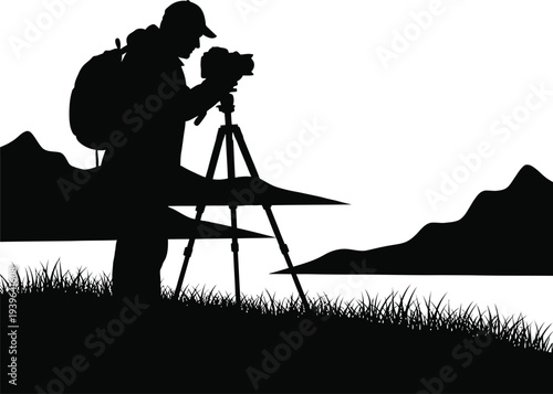 Silhouette of a photographer taking a picture with a camera on a tripod outdoors in nature