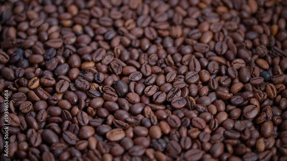 Fototapeta premium Coffee bean details, Shiny roasted coffee beans closeup, Close view of glossy brown coffee beans, Detailed perspective of rich chocolatecolored roasted coffee beans