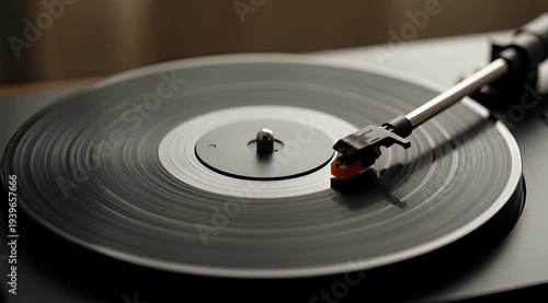 A closeup shot of a record player playing a black vinyl record