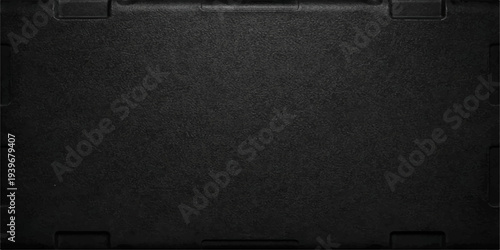 A dark textured black leather surface features a blank grunge pattern ideal for a vintage book cover or empty material background design