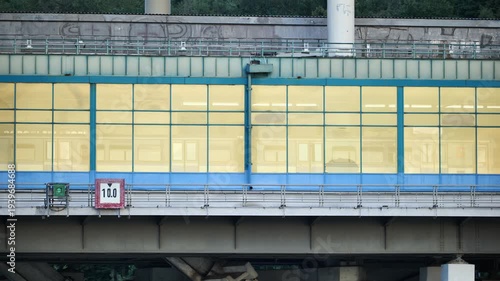 Luzhniki metro bridge showing architectural details and golden windows on a sunny day