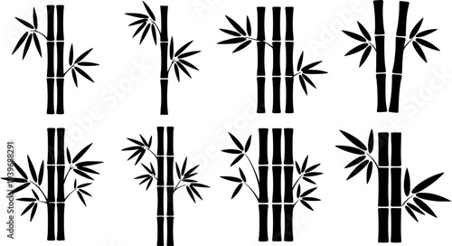 Collection of black bamboo stalk with leaves a white background stalks