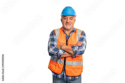 Senior worker wearing an orange reflective safety vest and blue hard hat, standing with crossed arms and looking at the camera on a white studio background