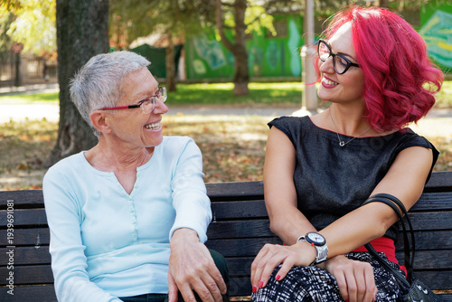 Women enjoying friendship and conversation in park