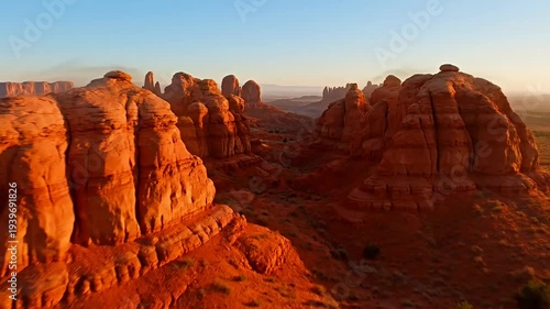 Spectacular sandstone formations bathed in golden light in remote Utah desert landscape