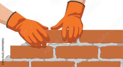 Two hands wearing bright orange protective gloves are meticulously laying a reddish-brown brick onto a fresh layer of grey mortar, constructing a brick wall.