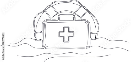 A medical first aid kit floating in water with a life preserver behind it.