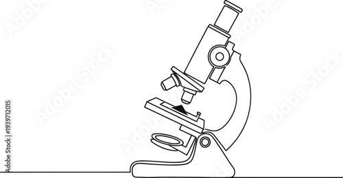 A microscope sits on a table in a laboratory setting for scientific research and experimentation.