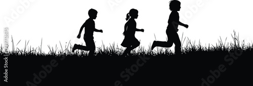 Three children running together in a field of tall grass on a sunny day