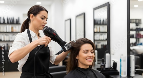 Hairdresser drying hair for happy client in modern salon, professional styling service