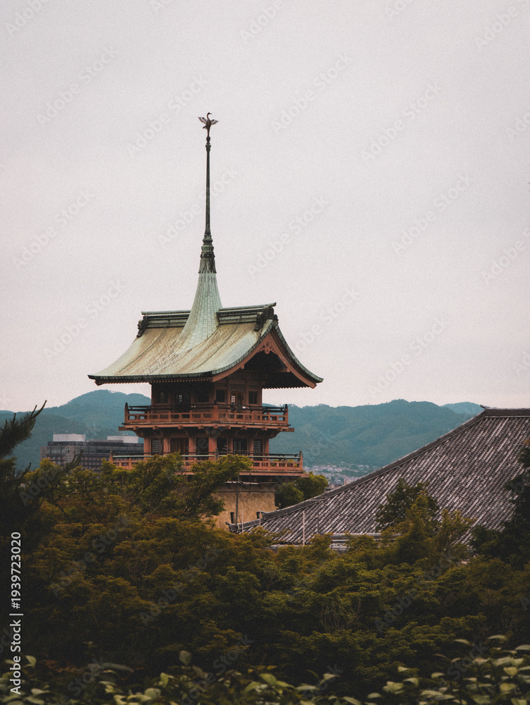 Fototapeta premium Traditional pagoda tower on forested hillside