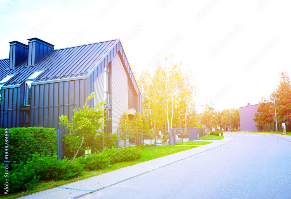Obraz premium Modern residential house in barnhouse style. Premium Suburban Scandi home. Deluxe Modern Prefabricated Concrete Panel Home. Black Barn Contemporary home. Modern Scandinavian Barnhouse. Barn House 