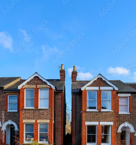 Victorian terraced houses in Hemel Hempstead, England, showing classic brick architecture and blue sky
