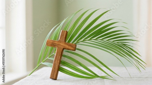 Wooden cross with palm leaves for Semana Santa Easter religious celebration minimalist background