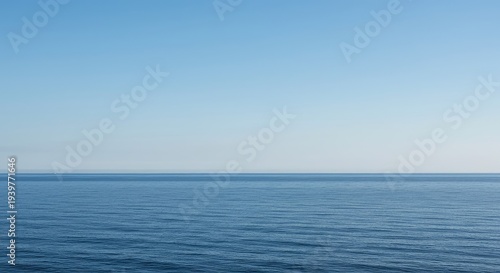 A minimalist scene depicting the endless ocean meeting a clear, featureless sky at a perfectly straight horizon line, nature, horizon, atmosphere