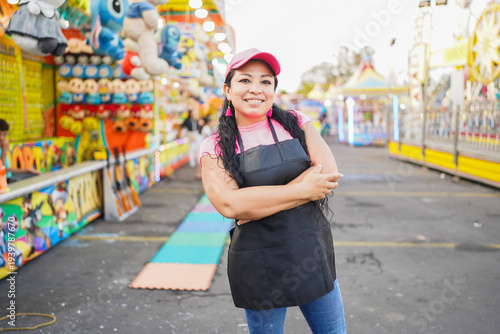 Latin woman entrepreneur working at amusement park carnival