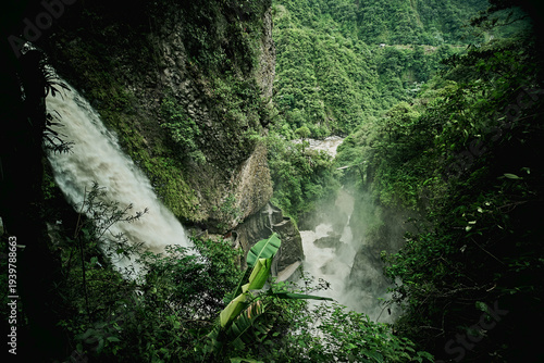 Pailón del Diablo waterfall in Baños Ecuador surrounded by lush jungle