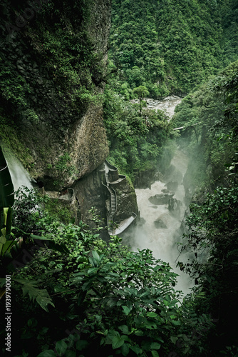 Pailón del Diablo waterfall in Baños Ecuador surrounded by lush jungle