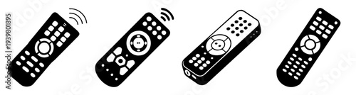 Set of four black universal remote controls isolated on white background for home electronics and smart devices