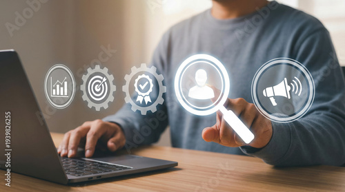 Wallpaper Mural Man Using Laptop With Interactive Icons for Customer Relationship Management and Digital Marketing Strategy Torontodigital.ca