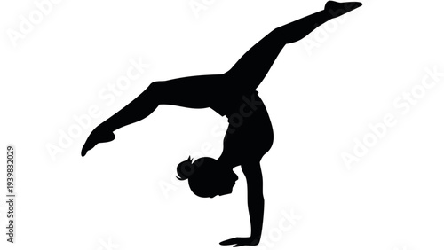 Flexible gymnast performing handstand with elegant pose