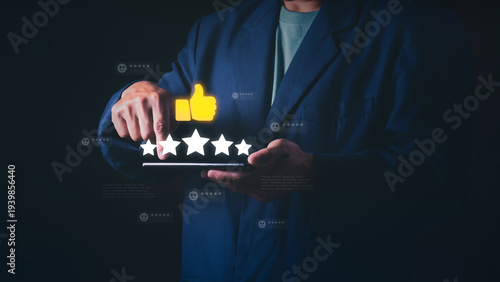 Close up of a businessman using a smartphone to give a five-star rating and thumbs up, Concept of customer satisfaction, excellent service feedback, and online reputation management.