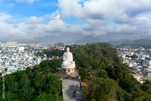 Quadro su tela Aerial panorama view Majestic Buddha statue overlooking Nha Trang cityscape with mountainous backdrop, landmark of Vietnam