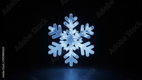 A single, illuminated, six-pointed, crystalline ice structure glows with a vibrant blue light against the stark darkness of the deep background representing winter cold and seasonal beauty.