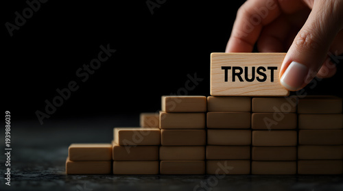 Wooden blocks forming steps with trust word