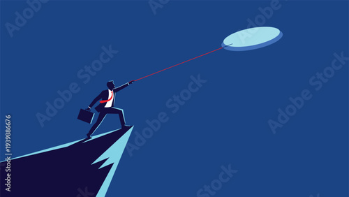 Businessman standing on a high mountain peak and using a rope to catch a glowing floating coin, illustrating the pursuit of financial goals.
