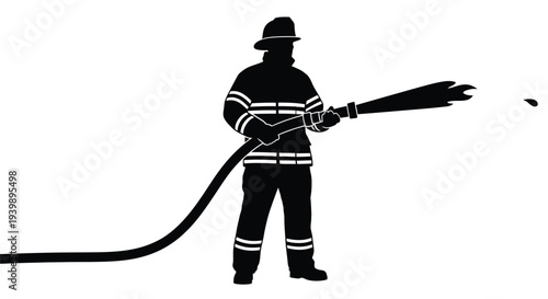 Silhouette of a firefighter holding and spraying a powerful stream of water from a fire hose nozzle during emergency response operations