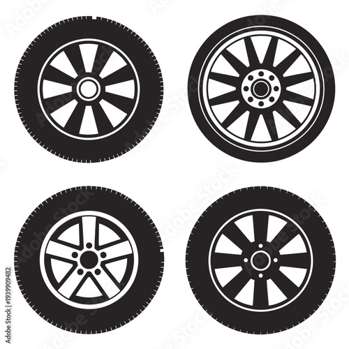 Four black and white car wheels with different spoke patterns