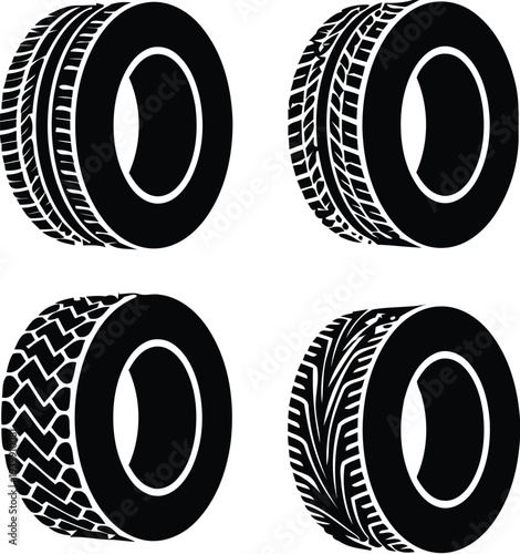 Four black tires with white walls in a square formation