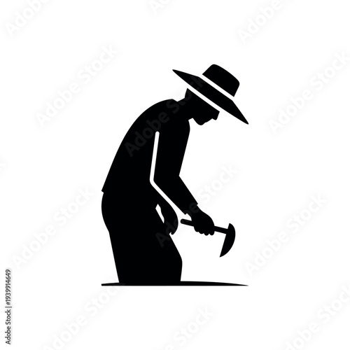 Silhouette of a man with a hat and a pickaxe.