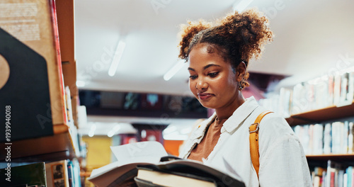 Quadro su tela Student, girl and reading book at shelf on campus for research, exam info or knowledge