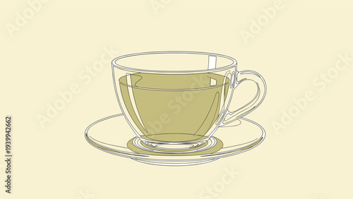 Elegant transparent glass tea cup filled with light green tea is placed on a matching saucer against a plain beige background.