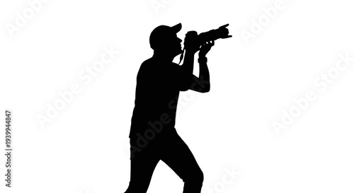 Silhouette of photographer taking picture with camera