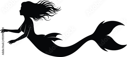 Silhouette of a mythical mermaid swimming in the ocean