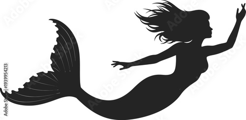 Mermaid silhouette swimming in oceanic depths