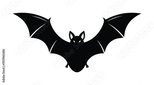 Vector of a bat with widely spread wings in flight silhouette