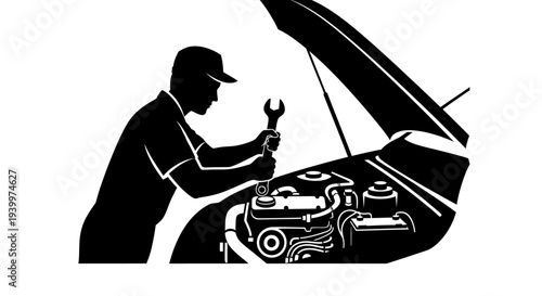 Mechanic working under car hood with wrench in hand